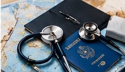 A stethoscope and passport resting on a map